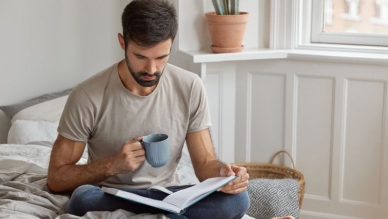 male reads book