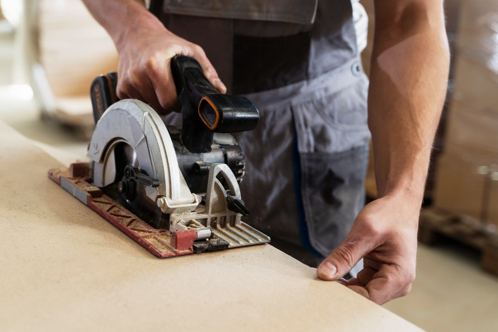 carpenter cutting wooden kitchen worktops